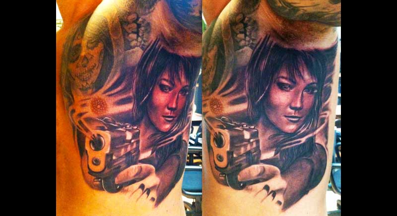 tatuaje mujer armada