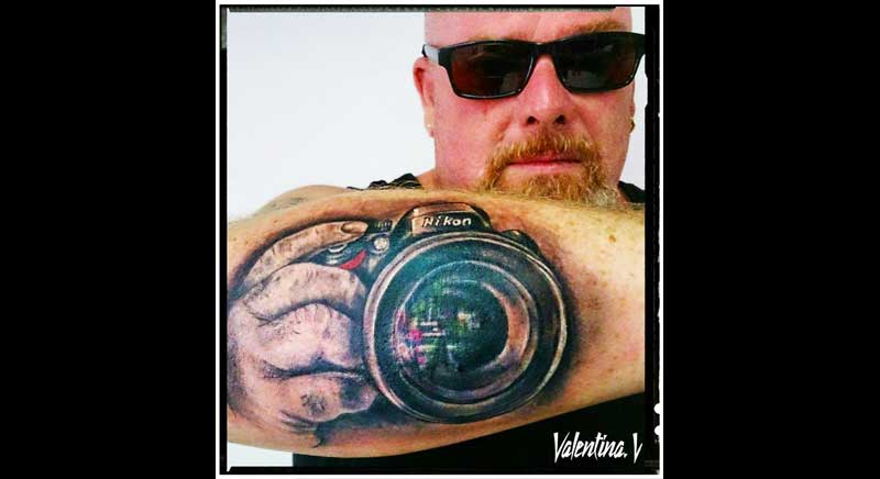 tatuaje camara de fotos